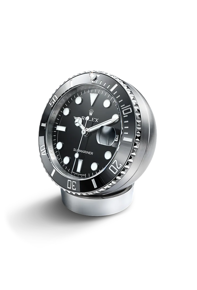 Rolex Submariner Date desk clock in stainless steel with a black lacquer dial, fixed 60-minute graduated, scratch-resistant cerachrom insert in black ceramic bezel, and  bracelet.