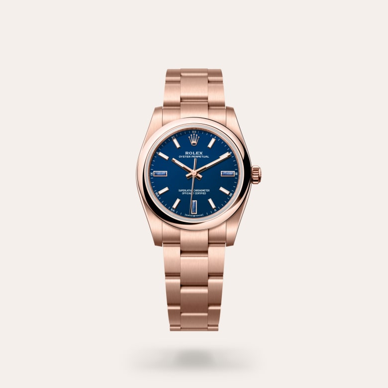 Rolex Oyster Perpetual 34 [M124205-0002] in 18 ct everose gold with a blue stone dial, domed bezel, and 18 ct everose gold bracelet.