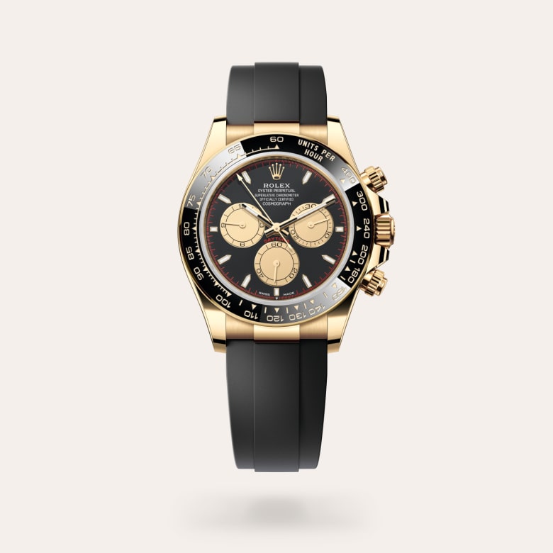 Rolex Cosmograph Daytona [M126518LN-0004] in 18 ct yellow gold with a intense black and champagne-colour dial, black monobloc cerachrom bezel in ceramic with moulded tachymetric scale bezel, and flexible metal blades overmoulded with high-performance elastomer bracelet.