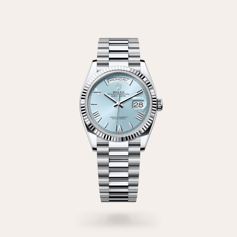 Rolex Day-Date 36 [M128236-0018] in platinum with a ice blue dial, fluted bezel, and platinum bracelet.