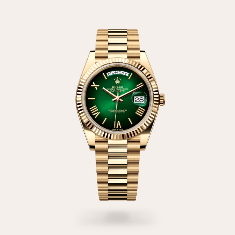 Rolex Day-Date 40 [M228238-0069] in 18 ct yellow gold with a green ombré dial, fluted bezel, and 18 ct yellow gold bracelet.