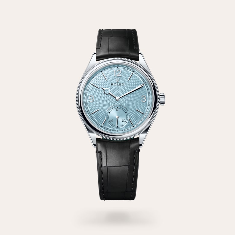 Rolex 1908 [M52506-0003] in platinum with a ice blue, rice-grain motif dial, domed and fluted bezel, and matt black alligator leather bracelet.