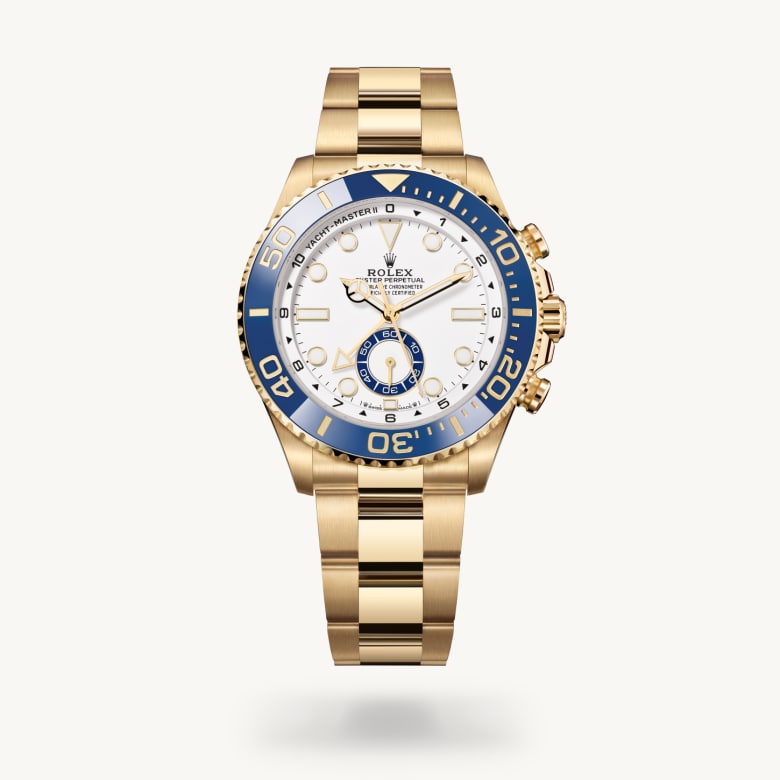 Rolex Yacht-Master II [M126688-0001] in 18 ct yellow gold with a white dial, bidirectional rotatable 60-minute graduated bezel with blue cerachrom insert in ceramic. moulded, recessed graduations and numerals coated with gold bezel, and 18 ct yellow gold bracelet - Kirk Freeport