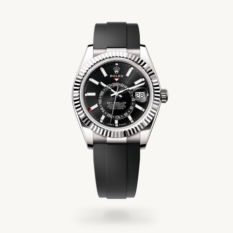 Rolex Sky-Dweller [M336239-0002] in 18 ct white gold with a bright black dial, fluted, bidirectional rotatable rolex ring command bezel, and flexible metal blades overmoulded with high-performance elastomer bracelet - Kirk Freeport