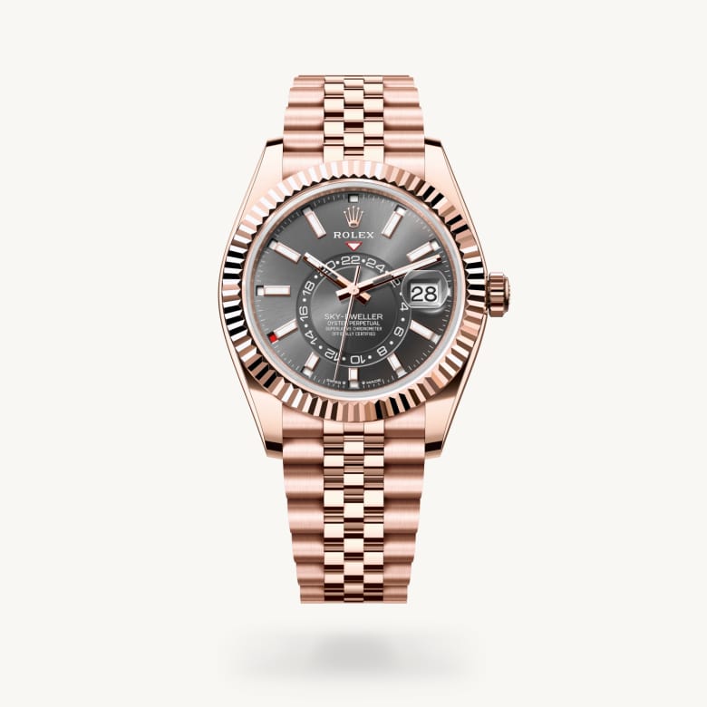 Rolex Sky-Dweller [M336935-0008] in 18 ct everose gold with a slate dial, fluted, bidirectional rotatable rolex ring command bezel, and 18 ct everose gold bracelet - Kirk Freeport