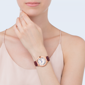 Cartier Watches woman wearing a pink and brown watch