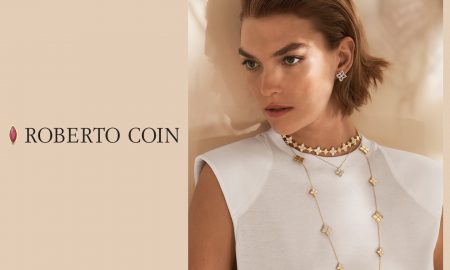 Roberto Coin woman modeling necklaces and earrings