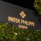 Kirk Freeport Debut of Patek Philippe's Traveling Collection projection of brand logo and title