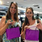 Urban Decay Launch Event two women holding gift bags filled with samples