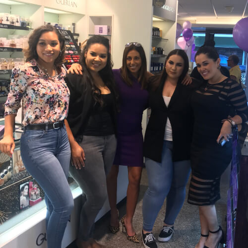 Urban Decay Launch Event Several employees and representatives posing in front of displays