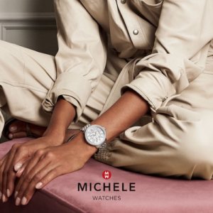 Michele Watches woman wearing a round silver watch with crystals
