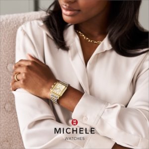 Michele Watches woman wearing a gold and silver watch