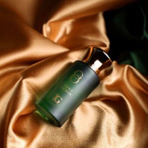 Ted Green Ghost Orchid fragrance in a sleek green glass bottle