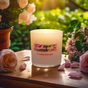 Ted Green Island Rose candle placed on table with floral backdrop